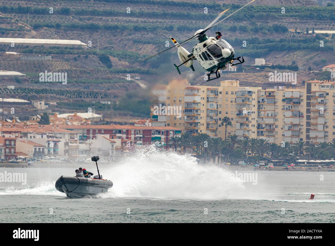 TORRE DEL MAR, MALAGA, SPAIN-JUL 12: Guardia Civil coast guard patrol and helicopter EC-135 taking part in a exhibition on the 4th airshow of Torre de Stock Photo