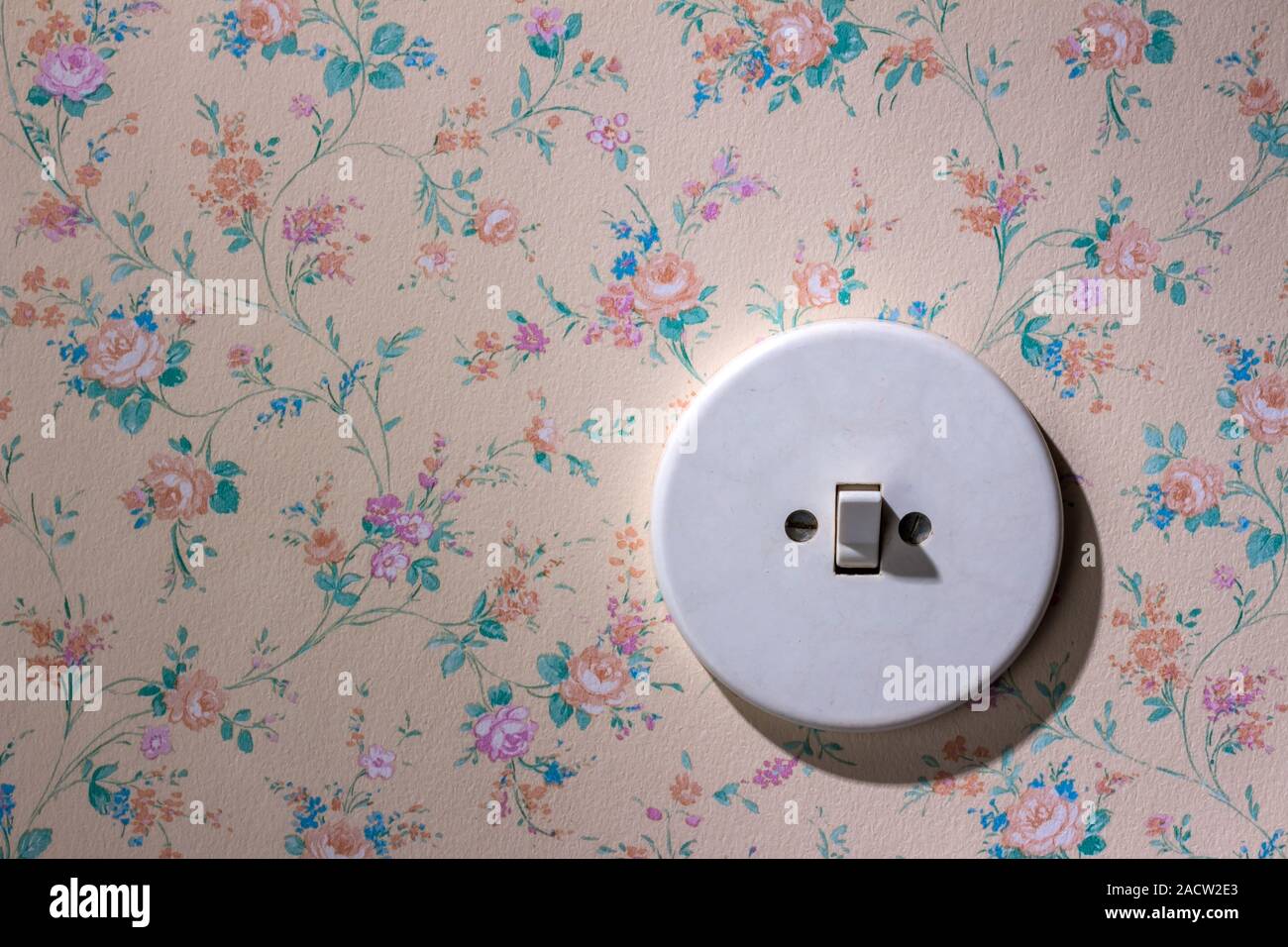 Old wallpaper with light switch Stock Photo - Alamy