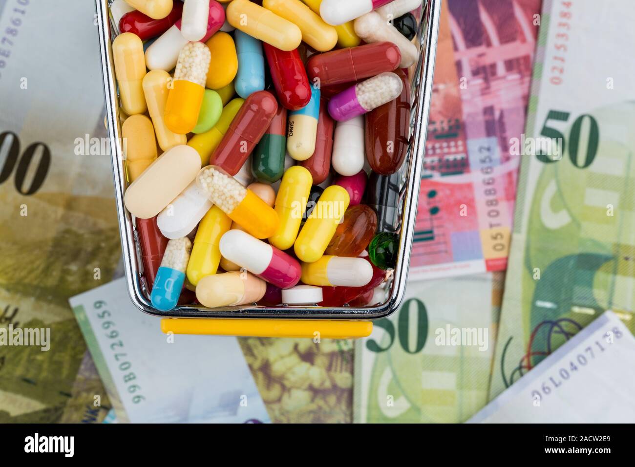 Tablets, shopping trolleys, banknotes Stock Photo