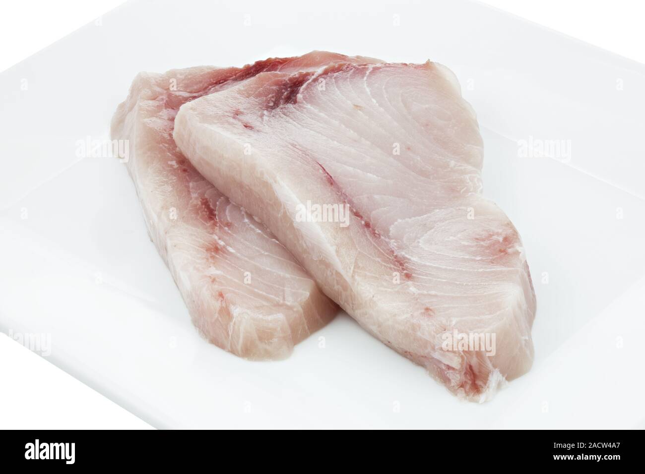 Two slices raw swordfish on plate Stock Photo Alamy