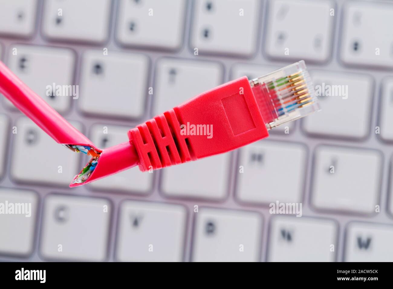 Defective network cable on keyboard Stock Photo