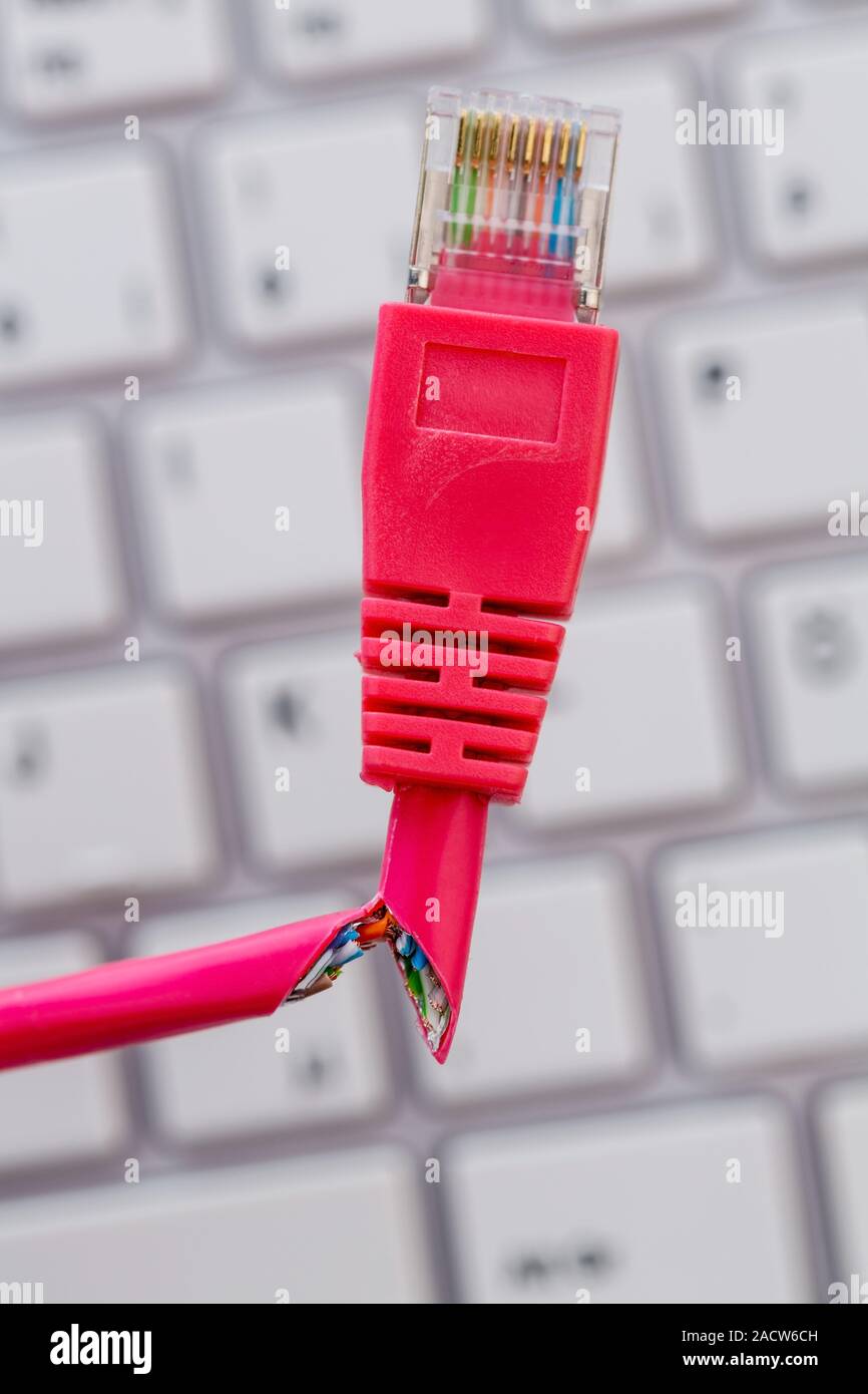 Defective network cable on keyboard Stock Photo