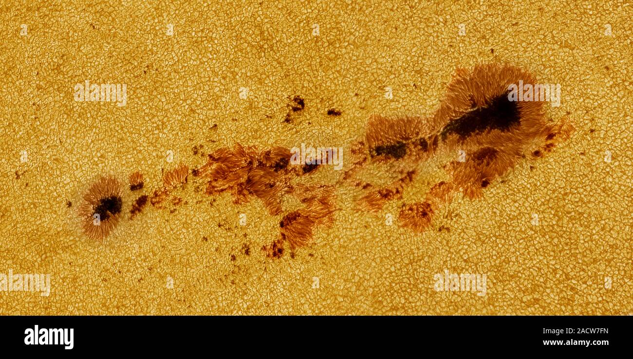 Sunspots (dark areas) on the surface of the Sun. Sunspots are areas of