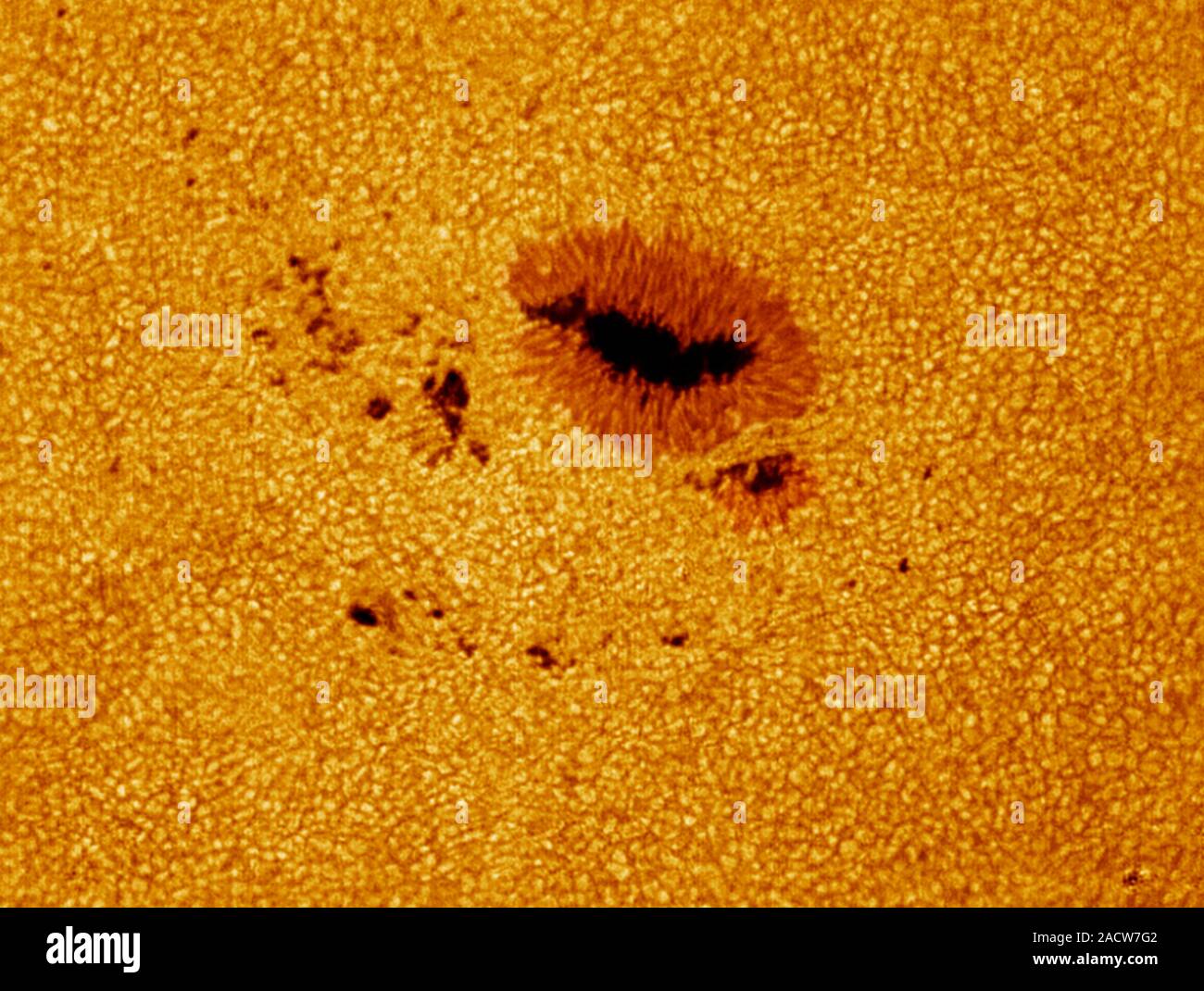 Sunspots (dark areas) on the surface of the Sun. Sunspots are areas of