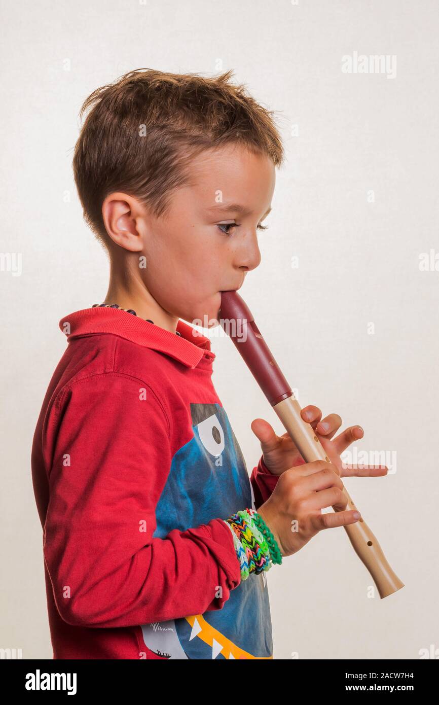 Child plays flute Stock Photo - Alamy