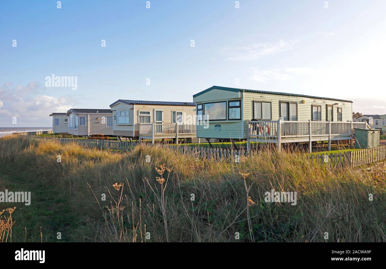 A holiday caravan site overlooking the beach and sea at Bacton, Norfolk, England, United Kingdom, Europe. Stock Photo