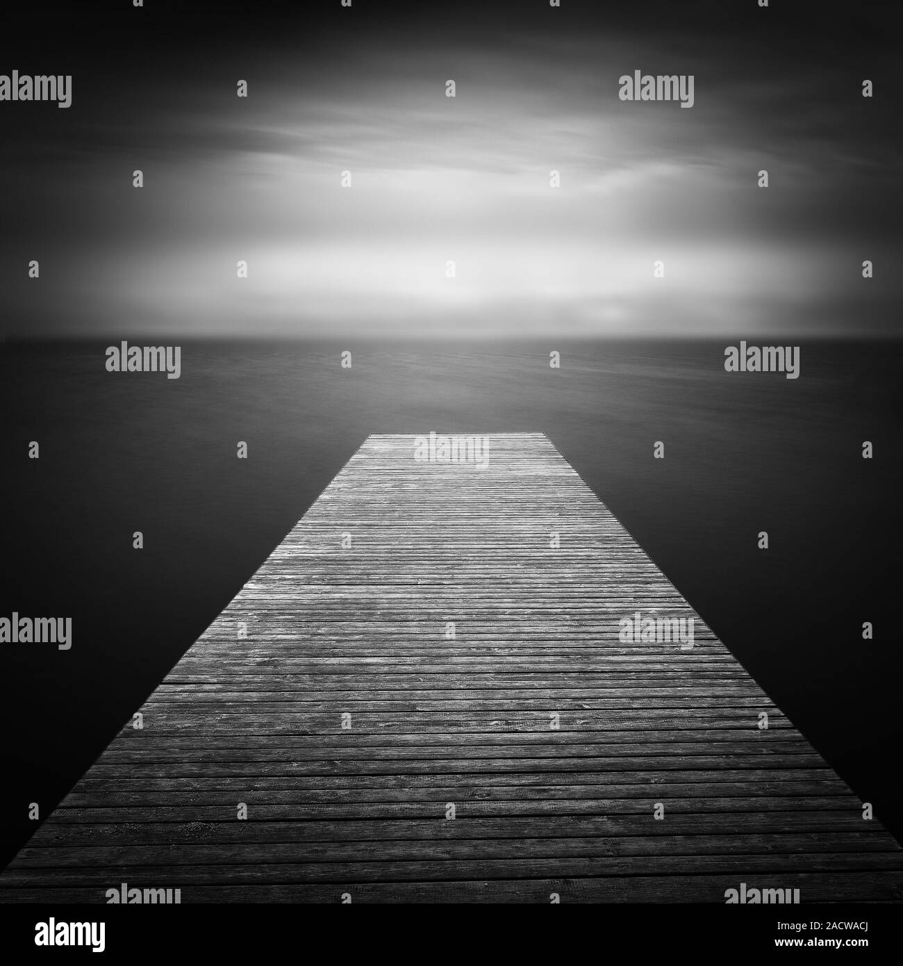 Boat landing stage at the lake, long-time exposure Stock Photo