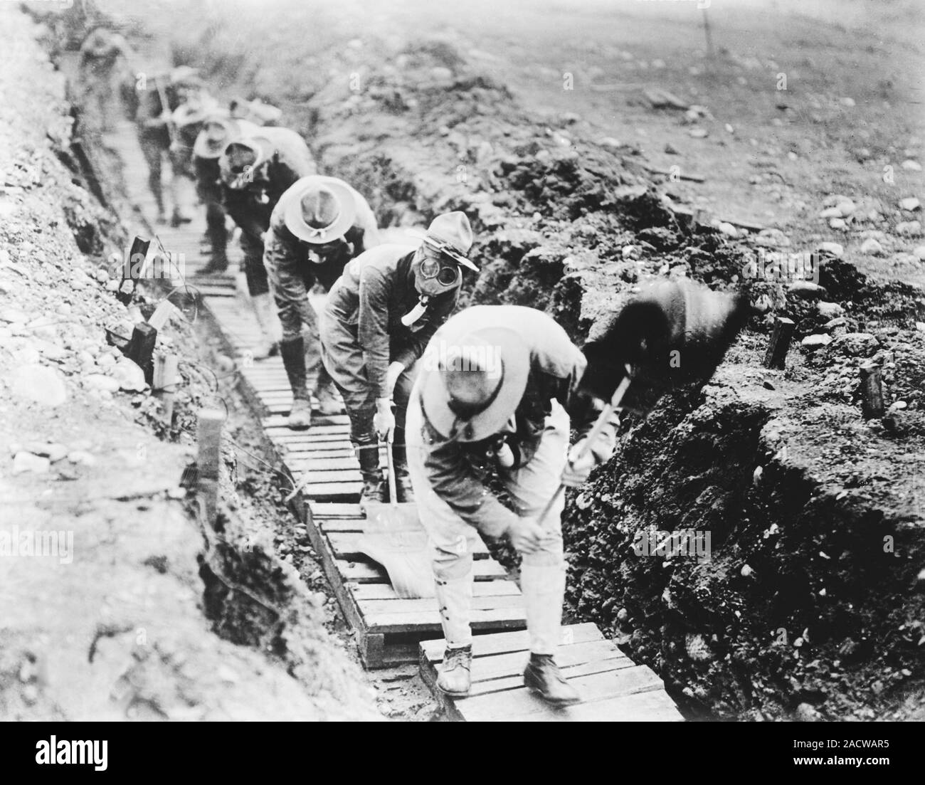 Fanning gas from a trench. US Army soldiers fanning gas from a trench