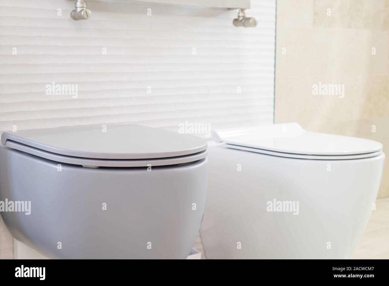 White And Gray Toilets Close up Modern Plumbing Toilet Assembly And White and gray toilets close up modern plumbing toilet assembly and