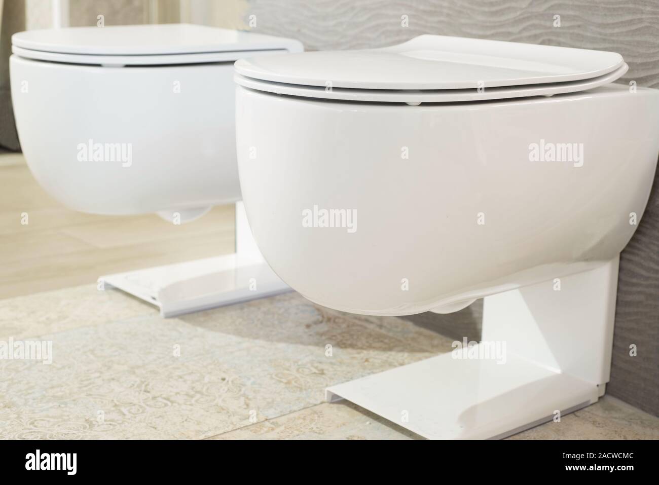 White And Gray Toilets Close up Modern Plumbing Toilet Assembly And White and gray toilets close up modern plumbing toilet assembly and