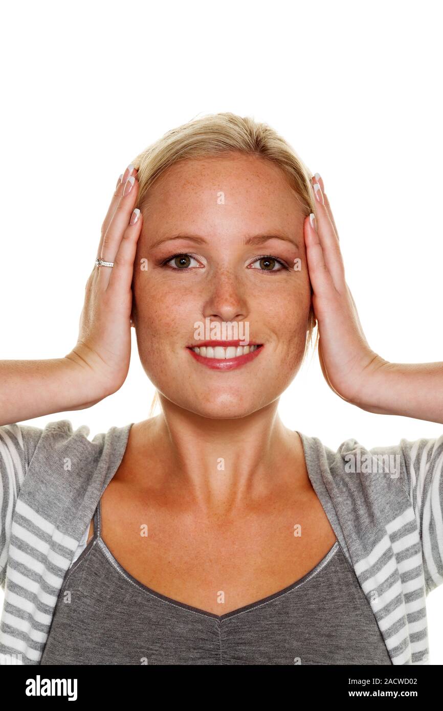 Woman covers her ears Stock Photo