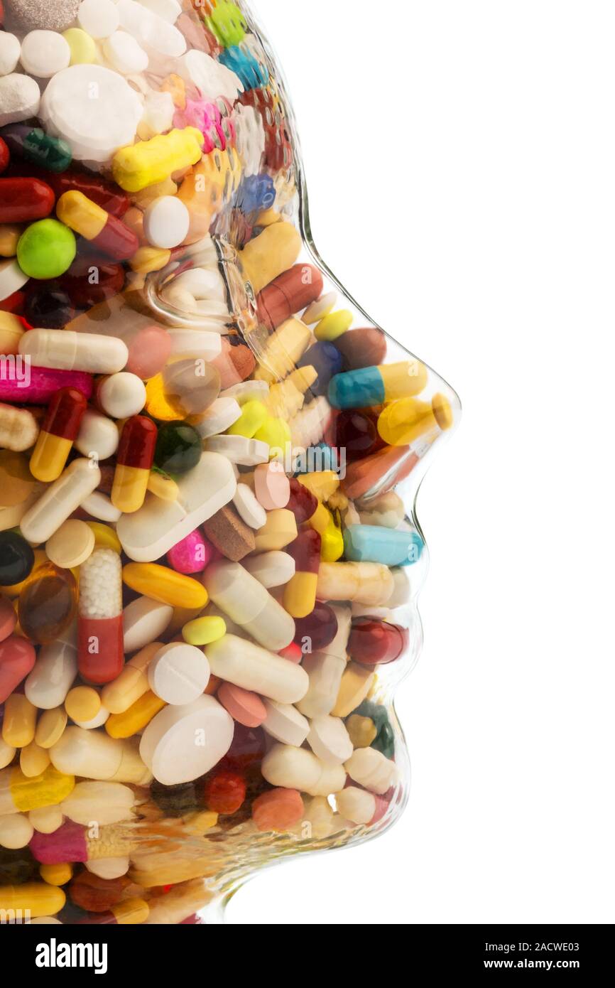 Glass head with tablets Stock Photo Alamy