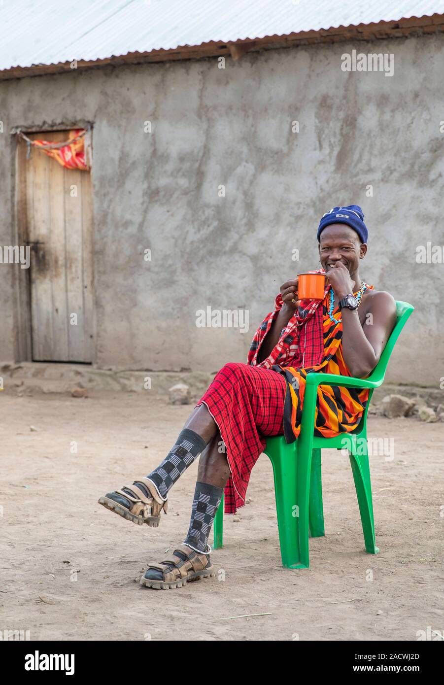 same, Tanzania, 11th June 2019: modern maasai resting and drinking coffee Stock Photo