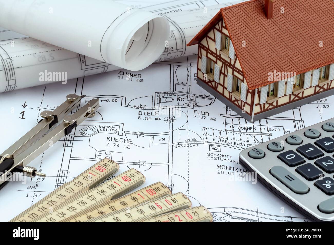 House plan with pocket calculator Stock Photo - Alamy