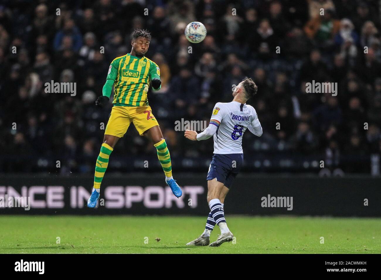 2nd December 2019, Deepdale, Preston, England; Sky Bet Championship, Preston North End v West Bromwich Albion : Kyle Edwards (21) of West Bromwich Albion heads clear as Alan Browne (8) of Preston North End pressures  Credit: Mark Cosgrove/News Images Stock Photo