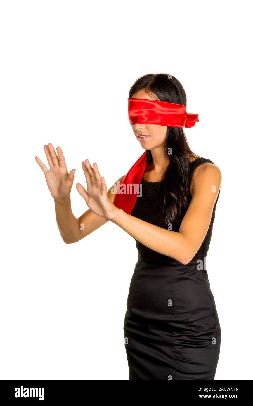 confused blindfolded woman on a white background Stock Photo