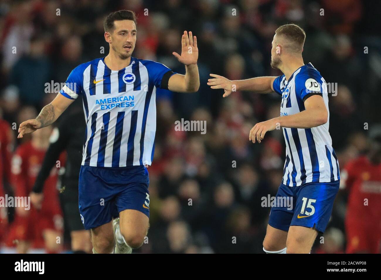 30th November 2019, Anfield, Liverpool, England; Premier League, Liverpool v Brighton and Hove Albion : Lewis Dunk (5) of Brighton  celebrates his goal to make it 2-1 Credit: Mark Cosgrove/News Images Stock Photo
