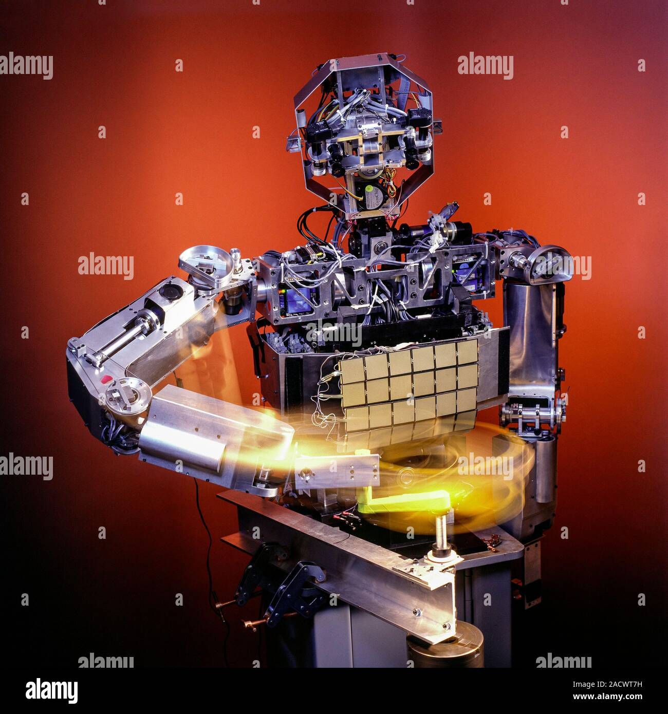 Cog android robot turning a handle. Cog (short for cognitive) is a robotic platform that was