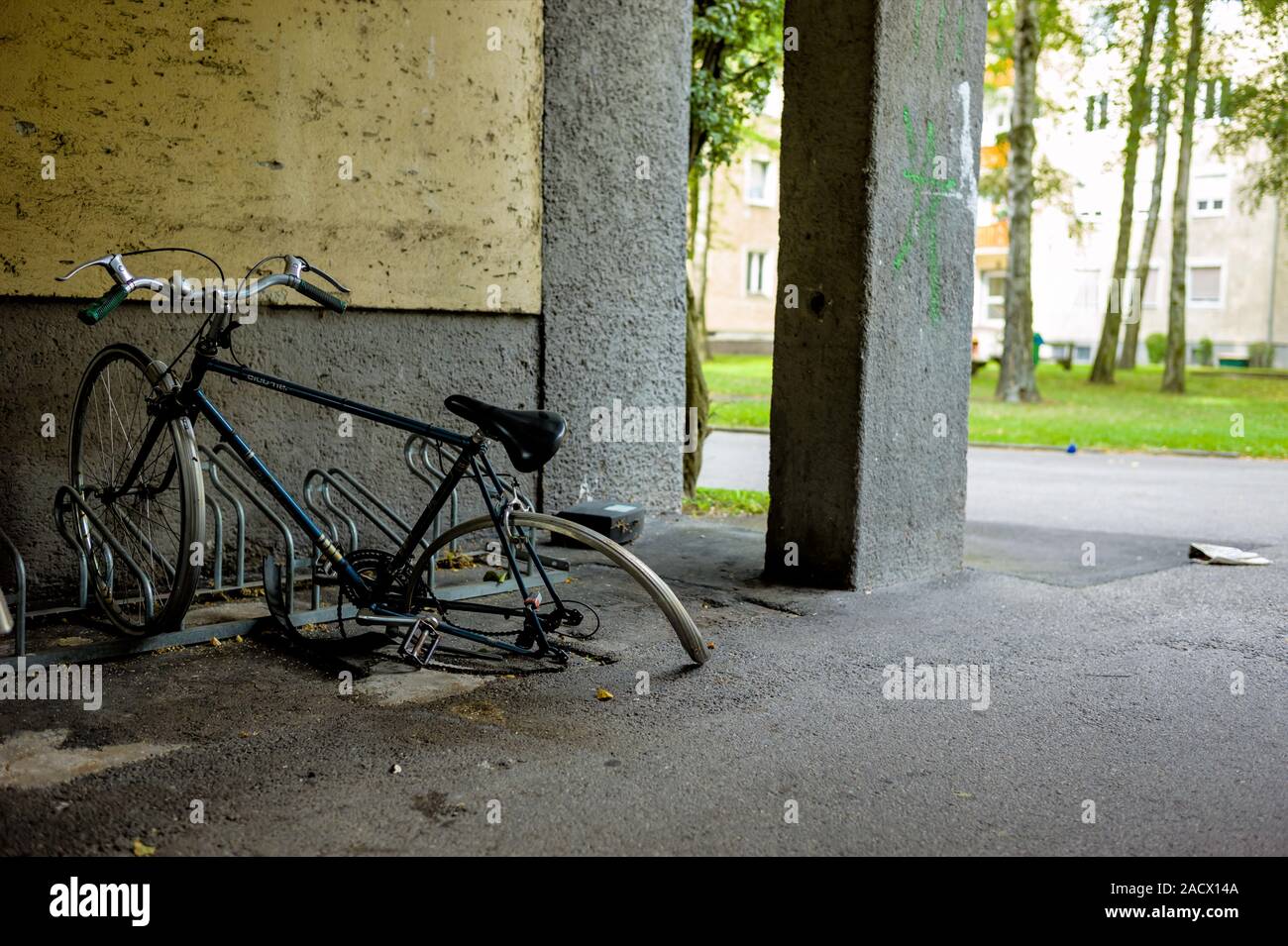 Broken bike in the bike rack Stock Photo Alamy