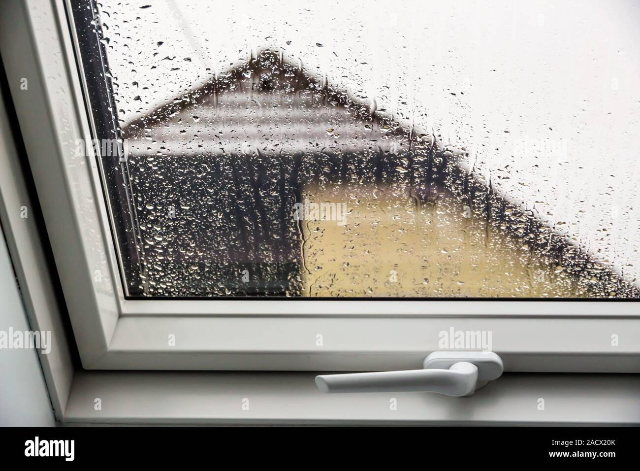 Rain on roof windows Stock Photo Alamy