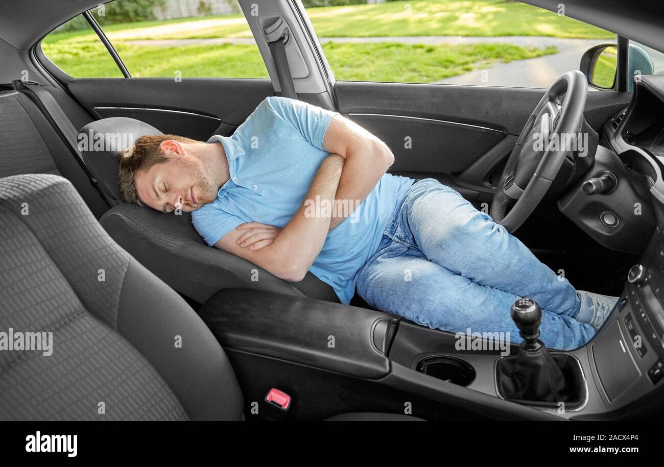 transport, rest and driving concept tired man or driver sleeping in