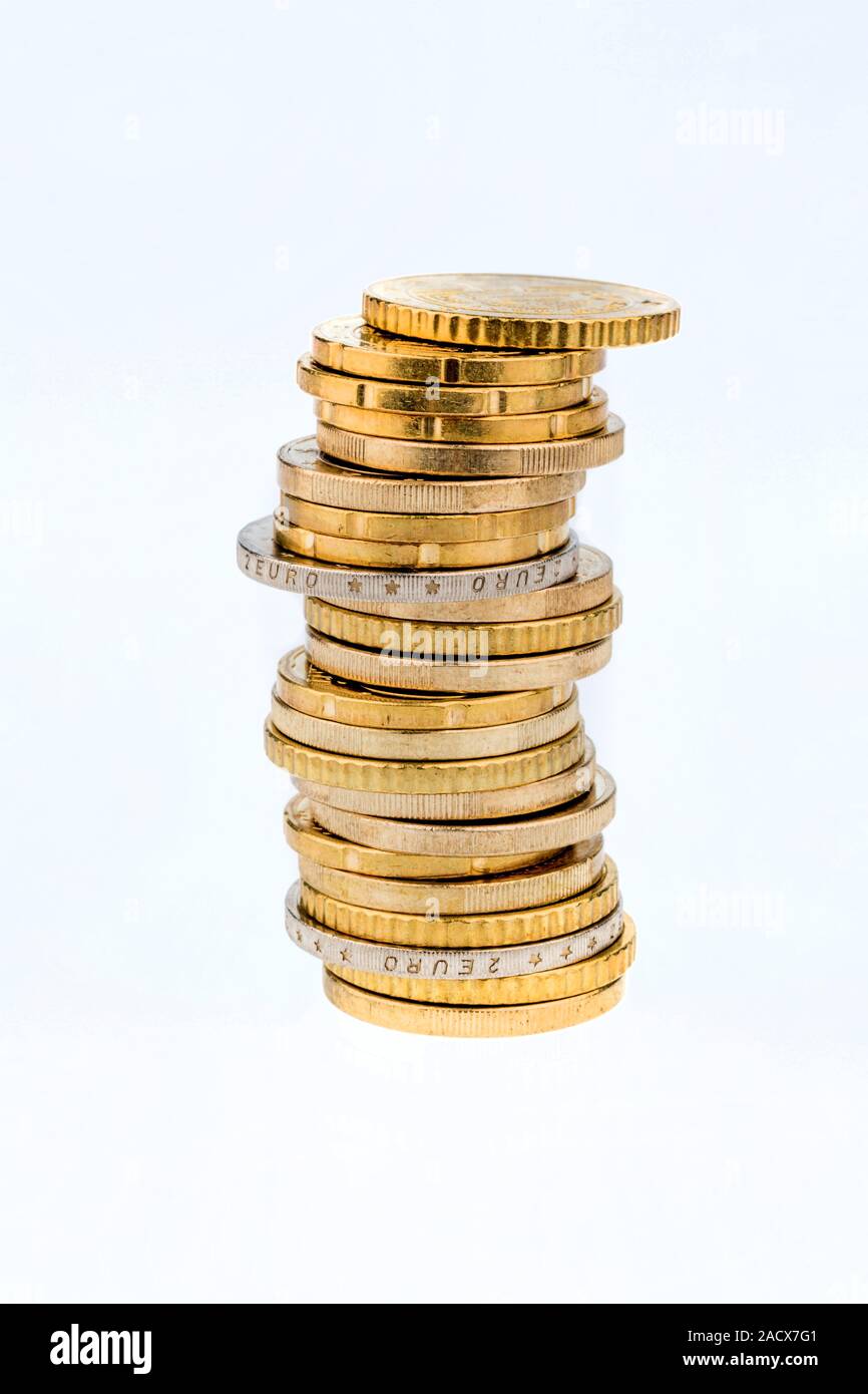 Stack of coins against a white background Stock Photo