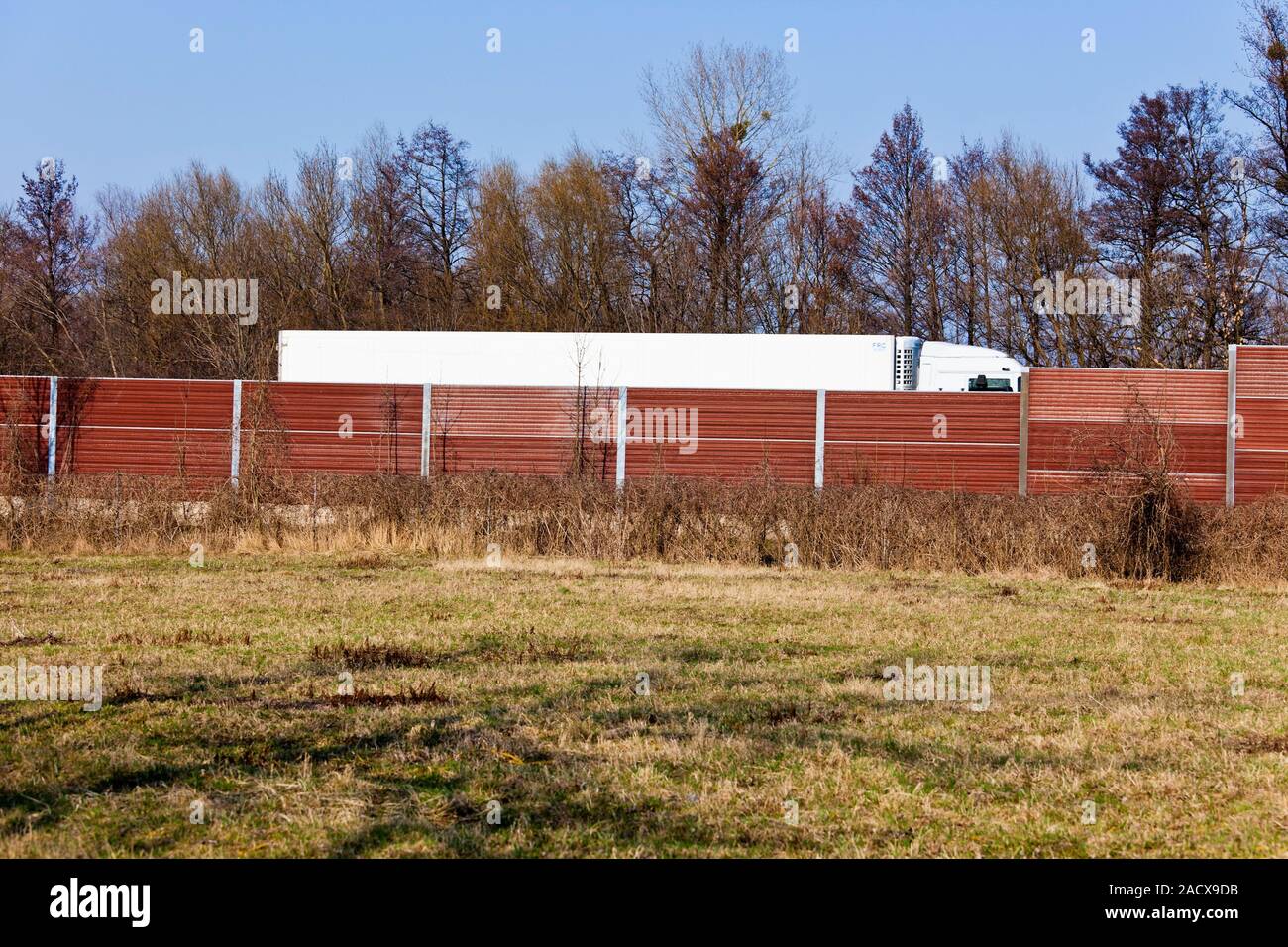 Noise barriers and trucks Stock Photo