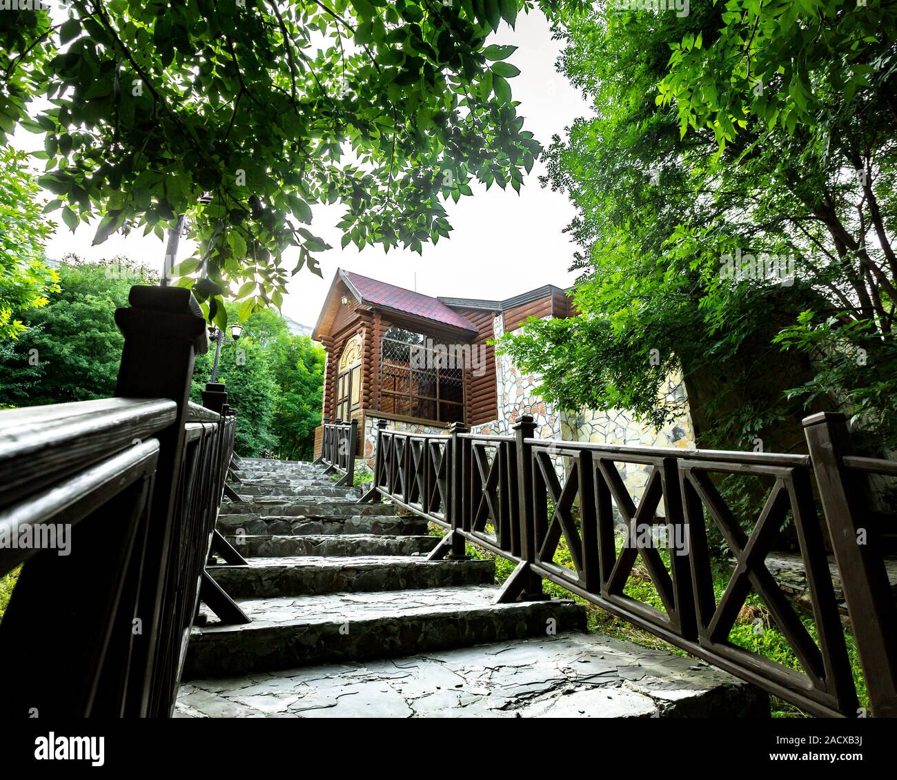 rocky stairs with wooden railing leading to the cottage Stock Photo - Alamy