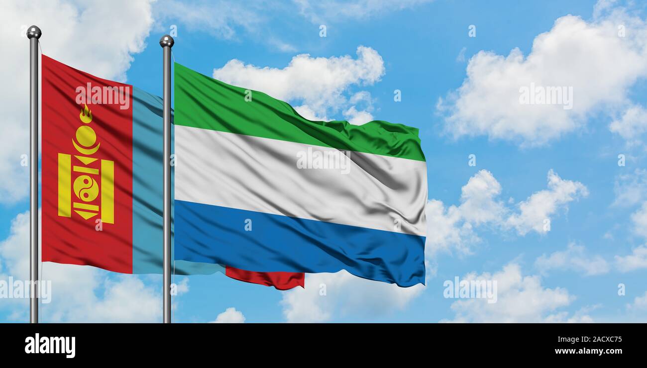 Mongolia and Sierra Leone flag waving in the wind against white cloudy blue sky together. Diplomacy concept, international relations. Stock Photo