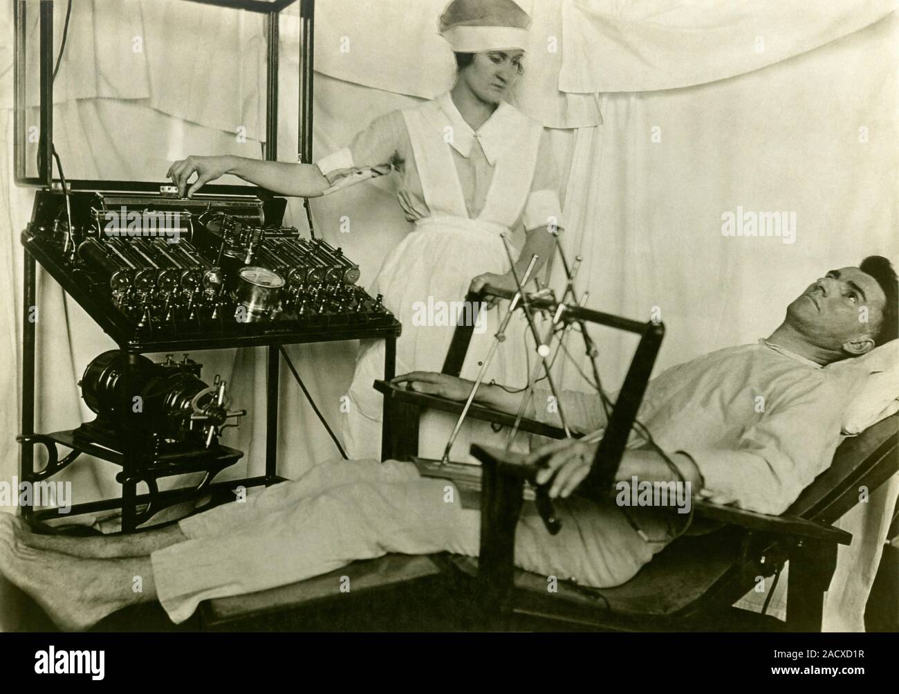Electrical treatment of shell shock. Man in a Bergonic chair, with