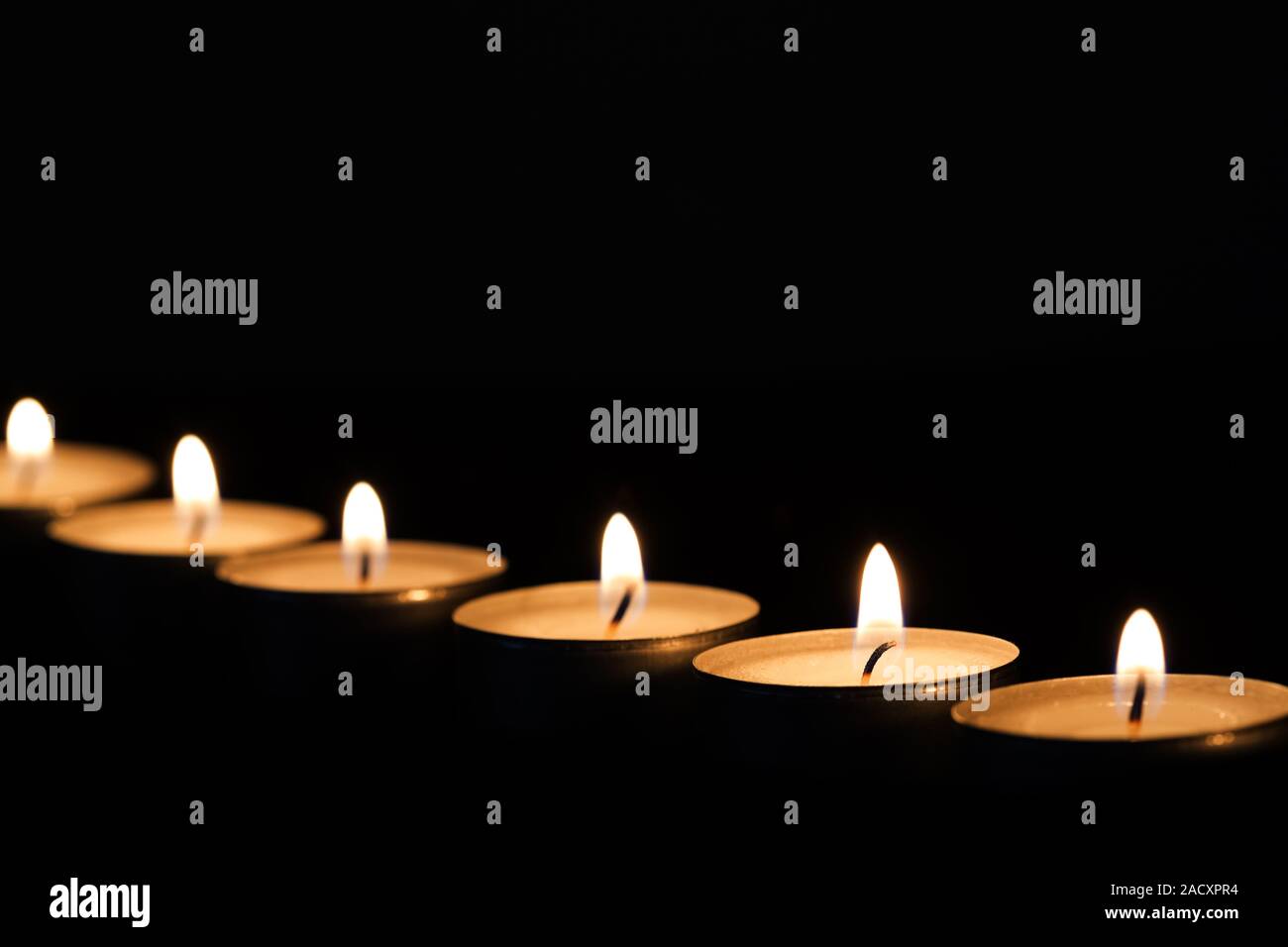 Burning tea lights Stock Photo Alamy