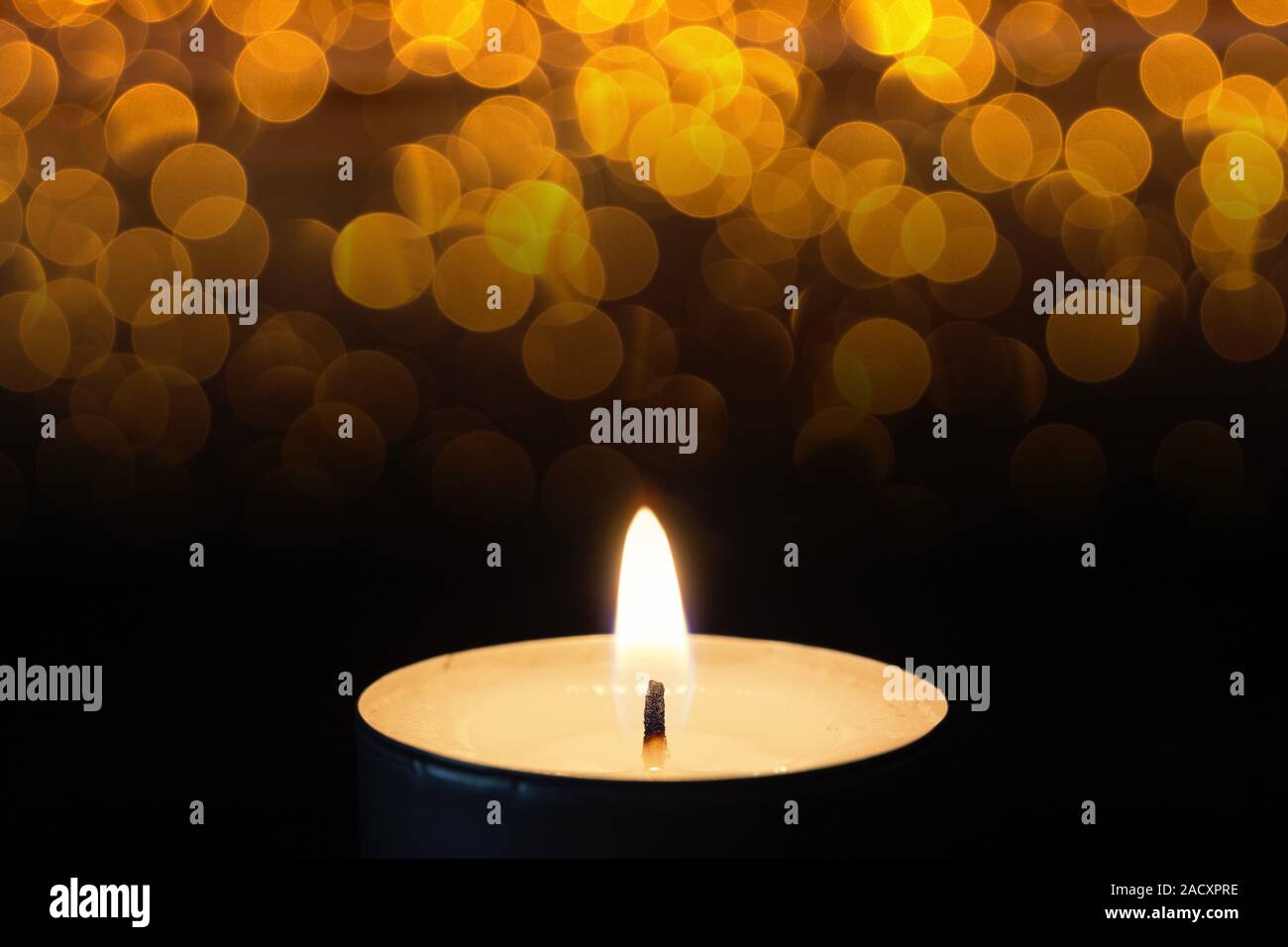 Burning tea lights with bokeh Stock Photo Alamy