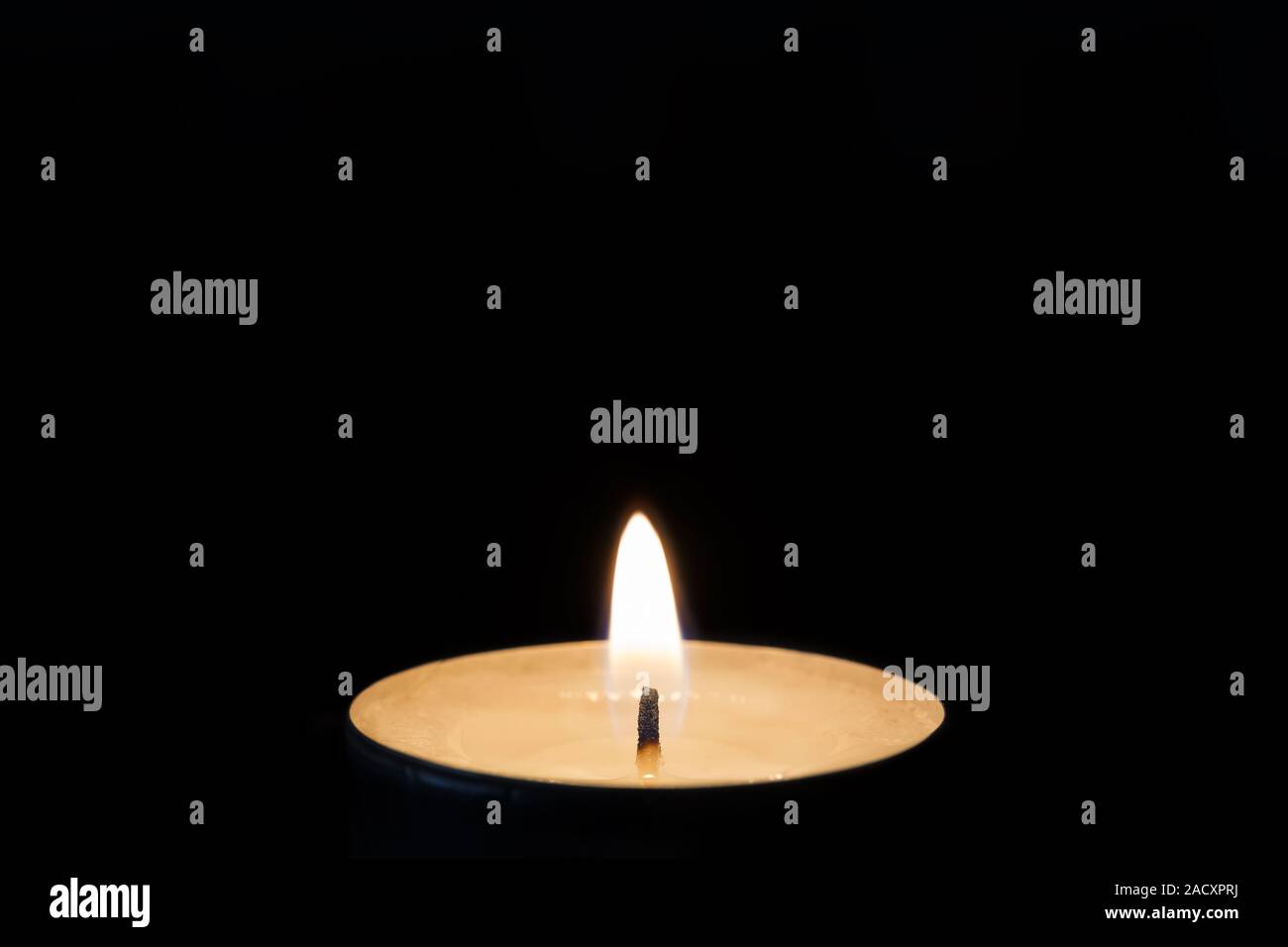 A burning tea light Stock Photo Alamy