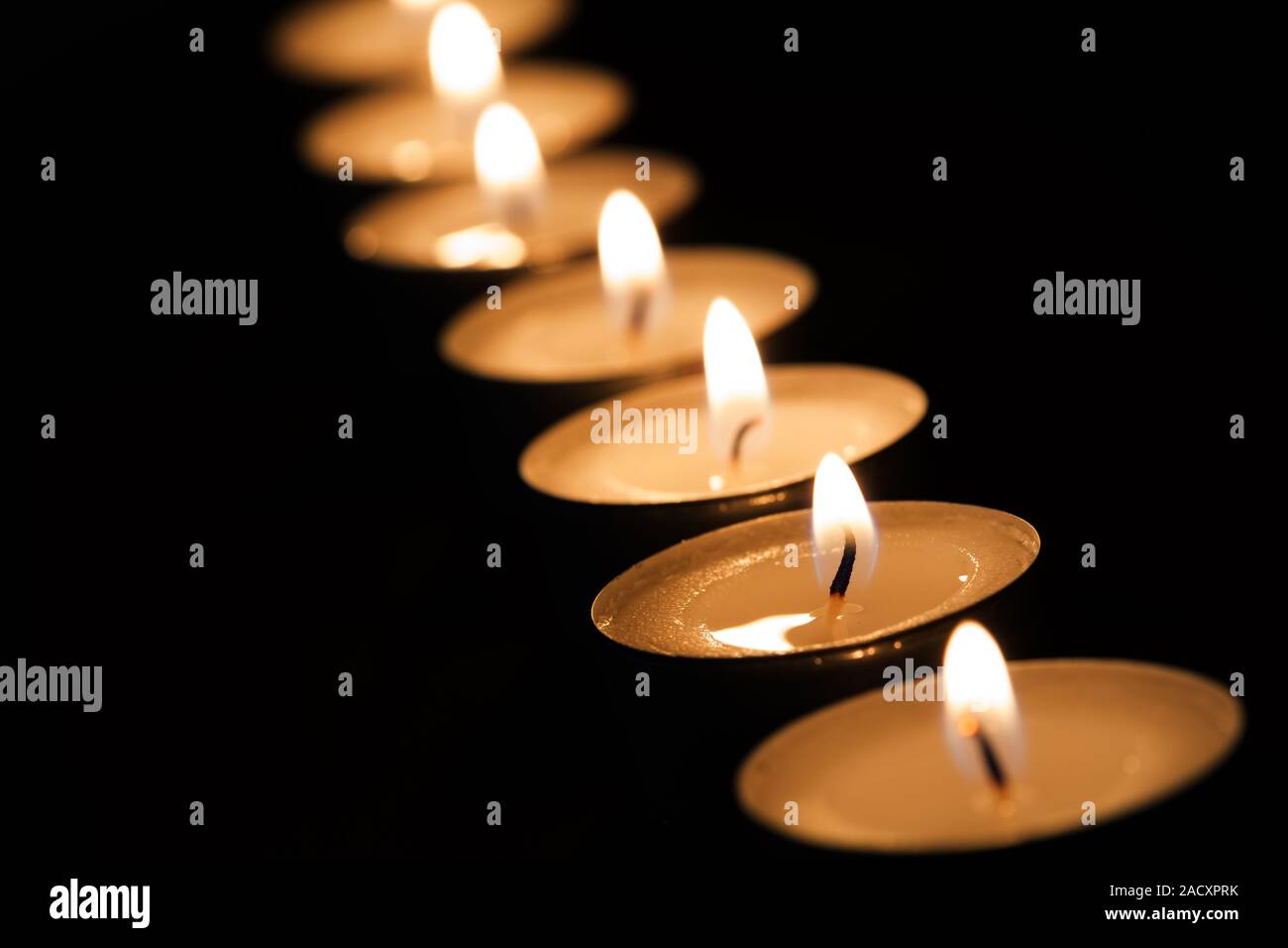 Burning tea lights Stock Photo Alamy