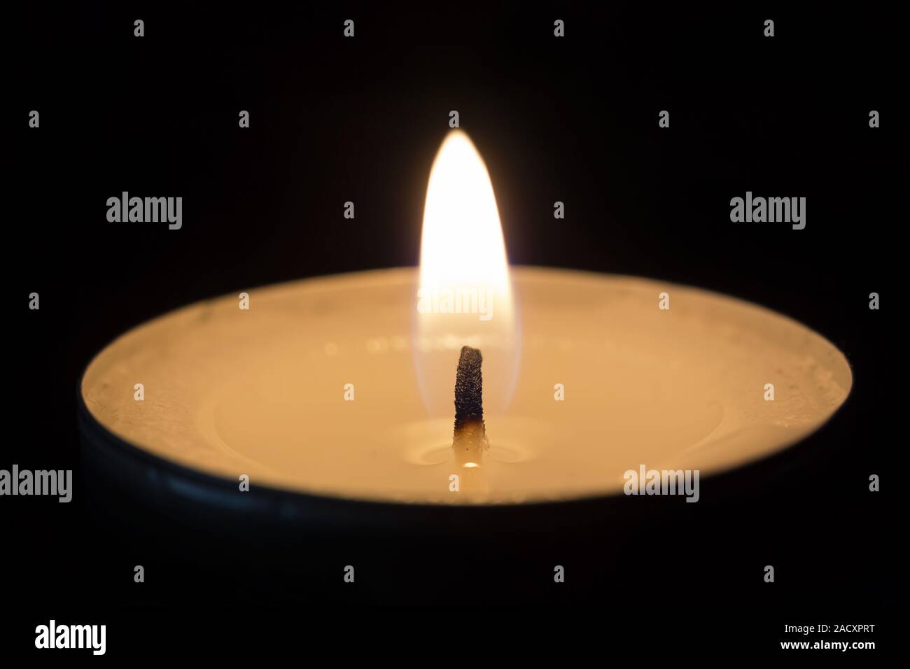 A burning tea light Stock Photo Alamy