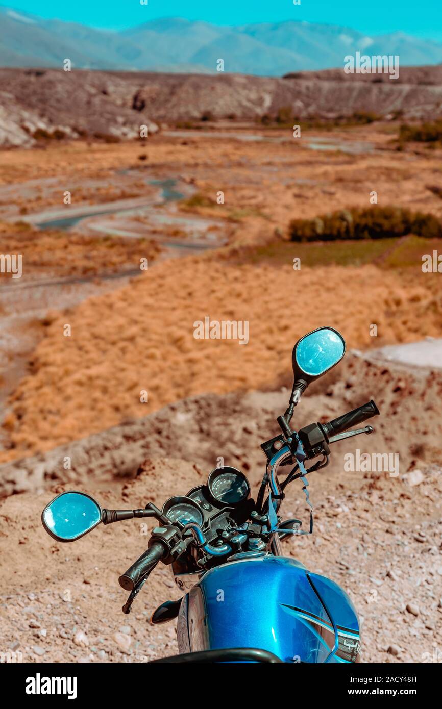 Sports motorcycle parked on hilly road Stock Photo