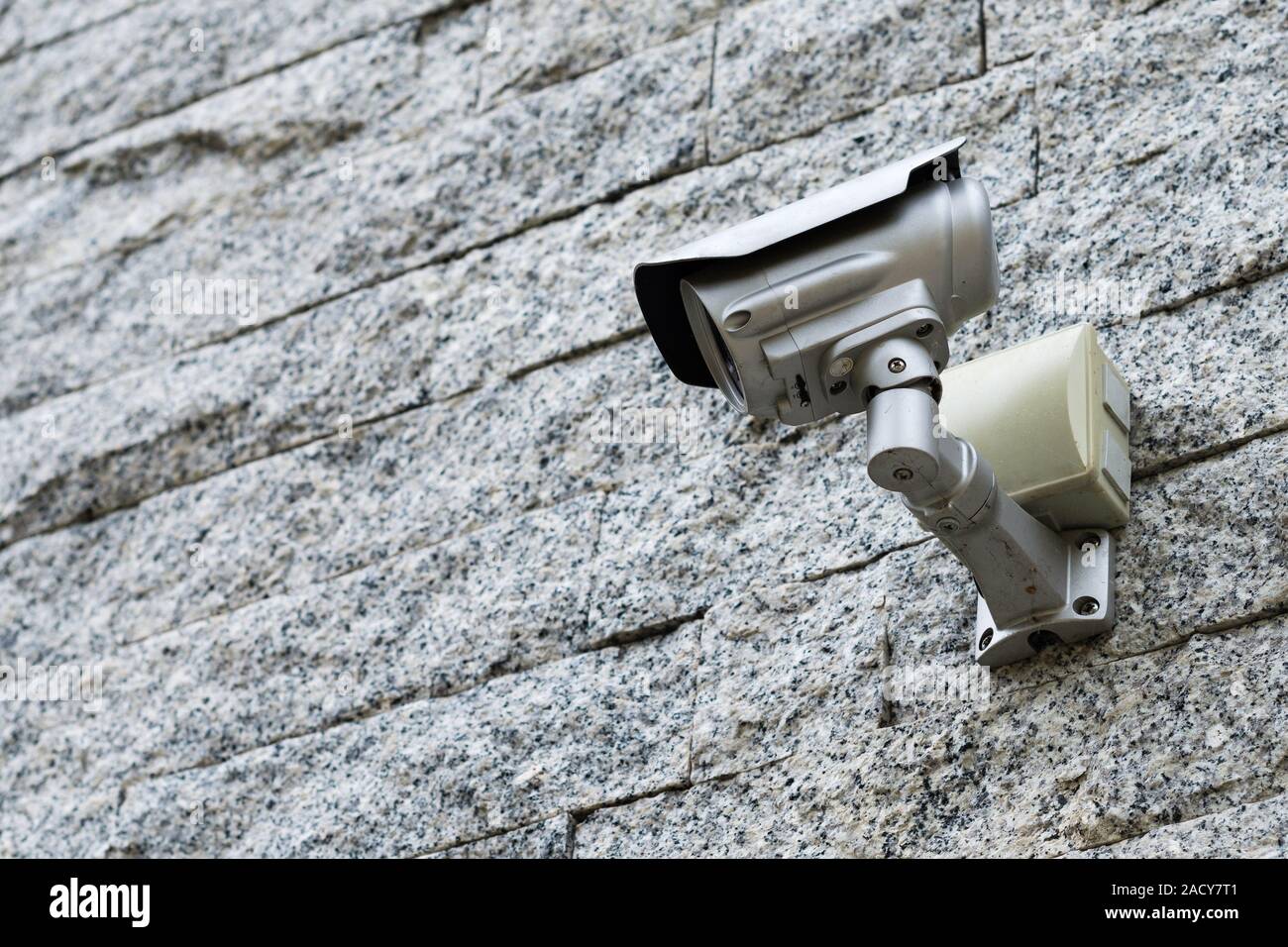 Security Camera on a grey stone wall Stock Photo Alamy