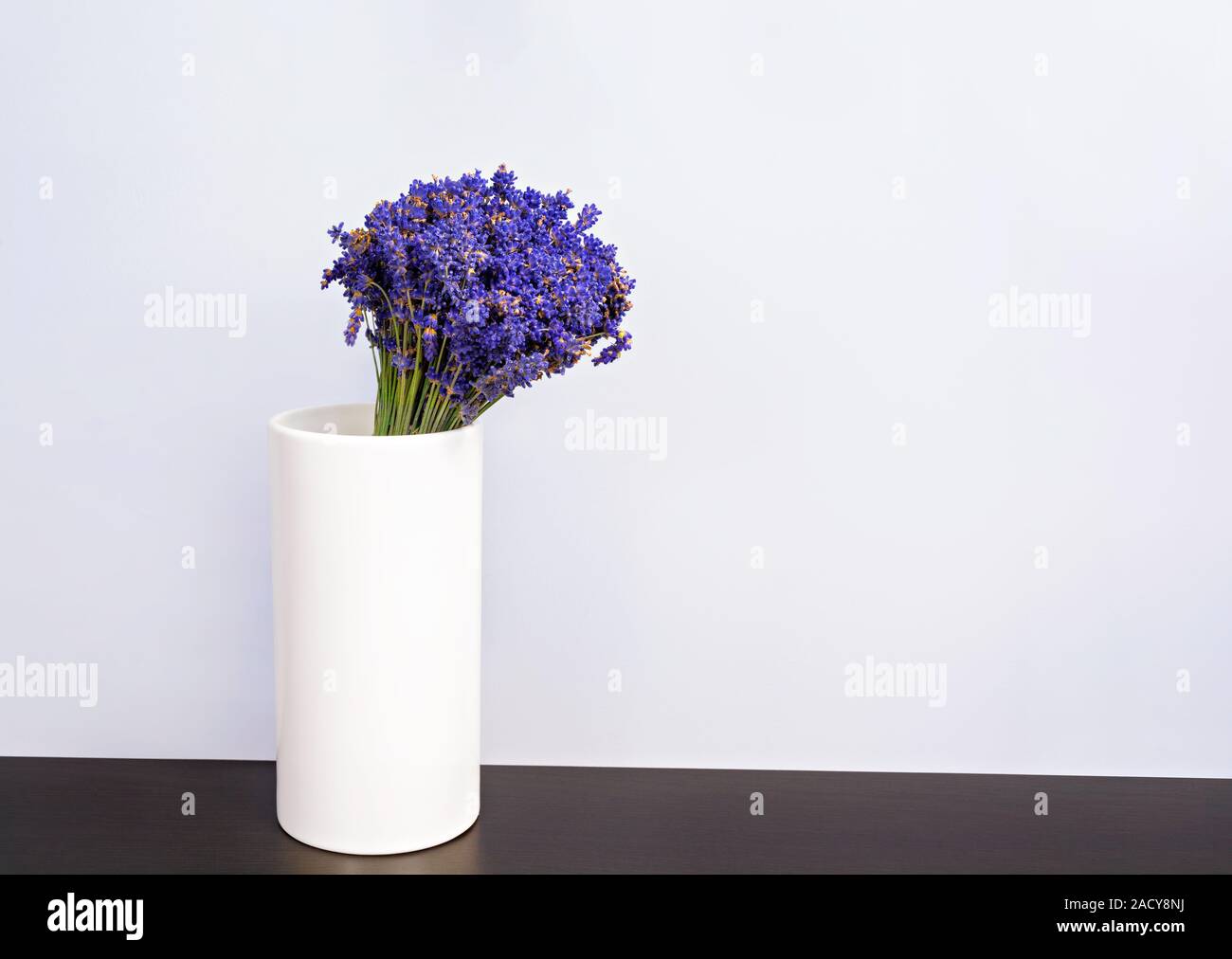 Lavender Bouquet In A Vase Sitting On A Table In Living Room