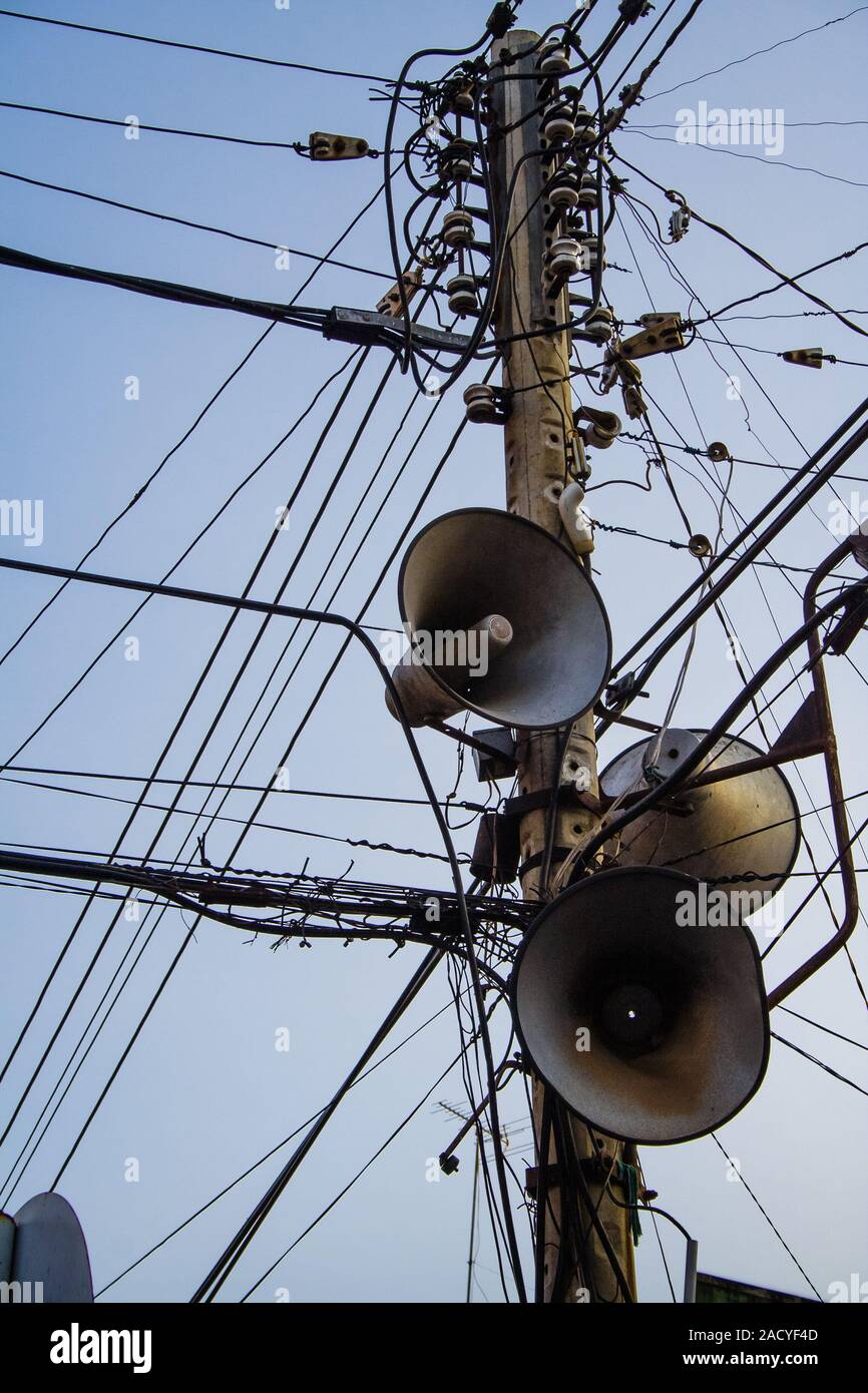 Speakers of the public address system installed on an electrical contraption in downtown My Tho, South Vietnam. Stock Photo