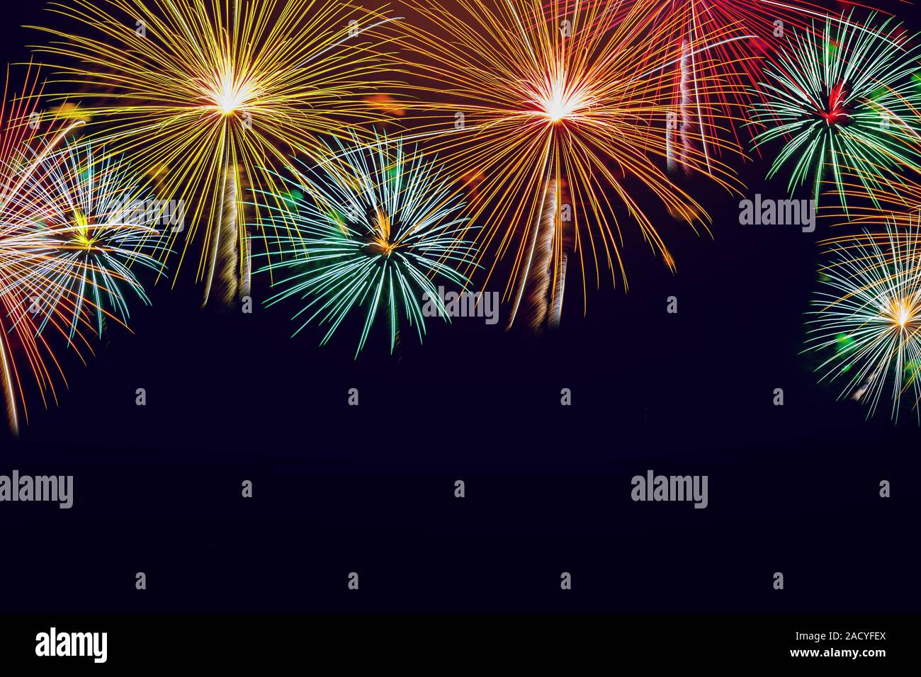 Fireworks on night sky background for your holiday, christmas, New Year and celebration theme concept design. Stock Photo
