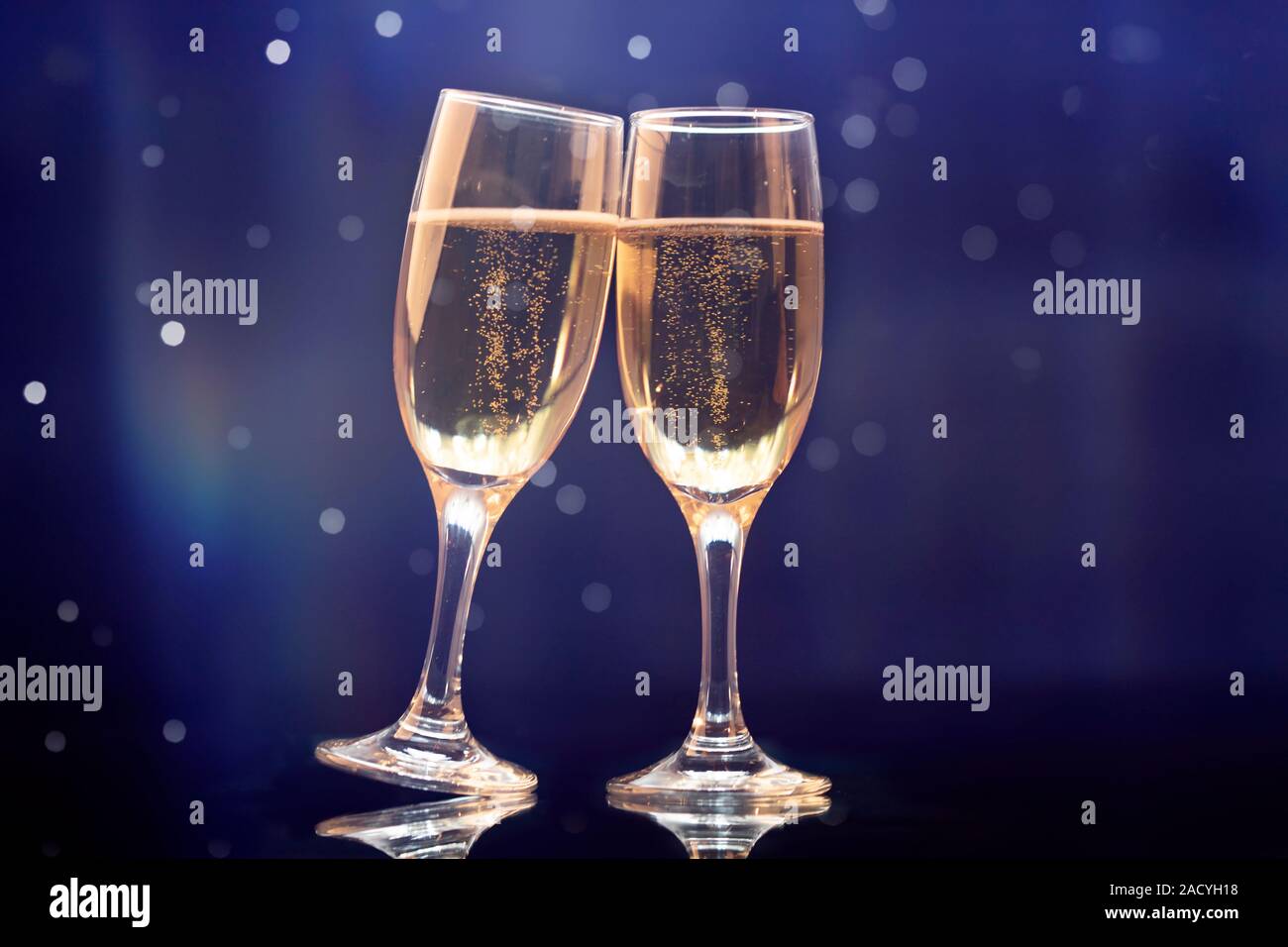 Champagne glasses on sparkling holiday background - Celebrating the New ...