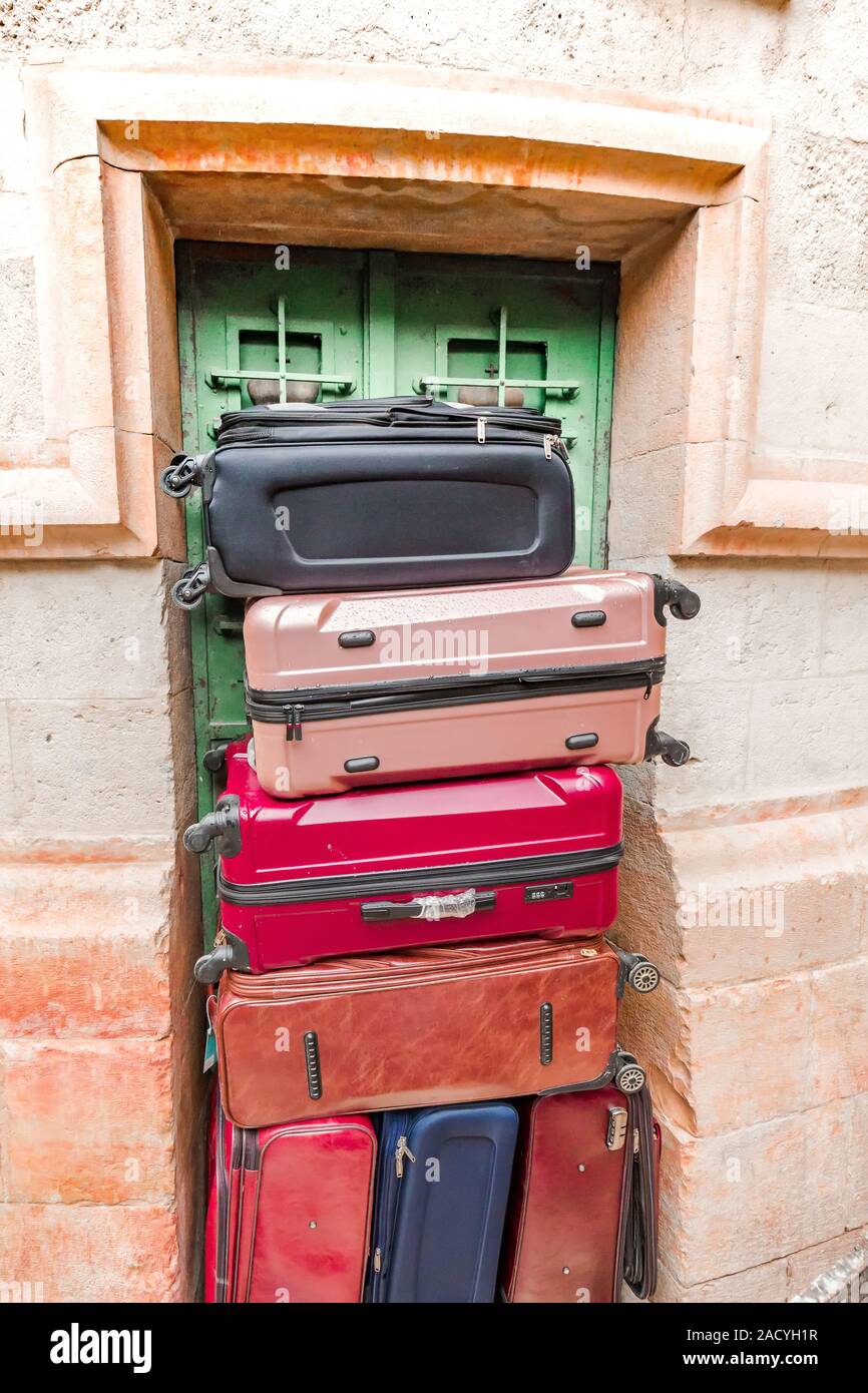 A stack of suitcases standing in the doorway and closing the green door,  Jerusalem, Israel Stock Photo - Alamy