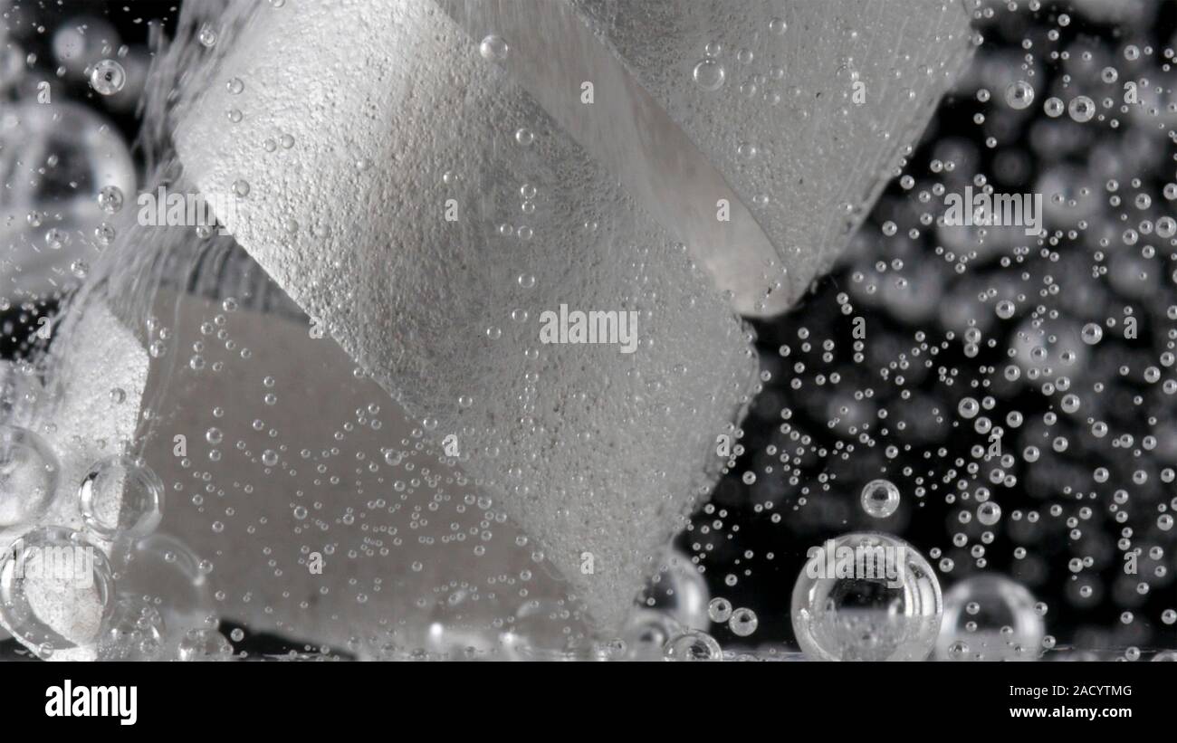 Magnesium reacting with acetic acid and generating hydrogen bubbles