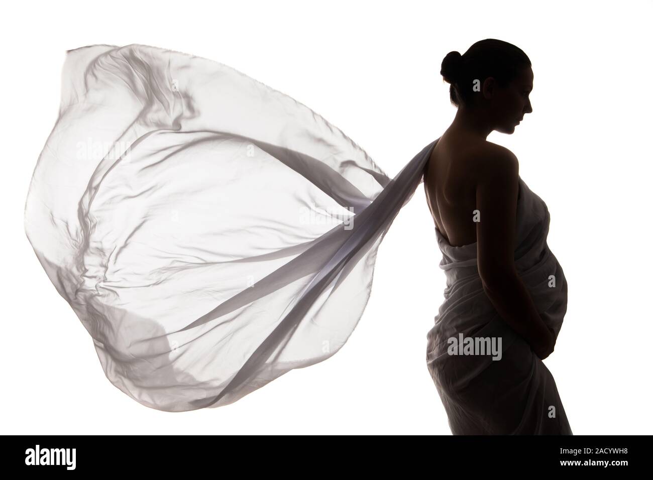 Beautiful pregnant woman in white chiffon shawl Stock Photo