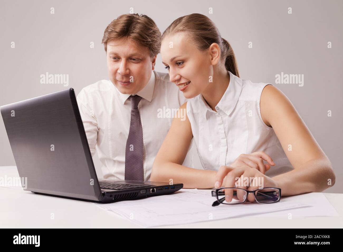 Business couple using laptop Stock Photo