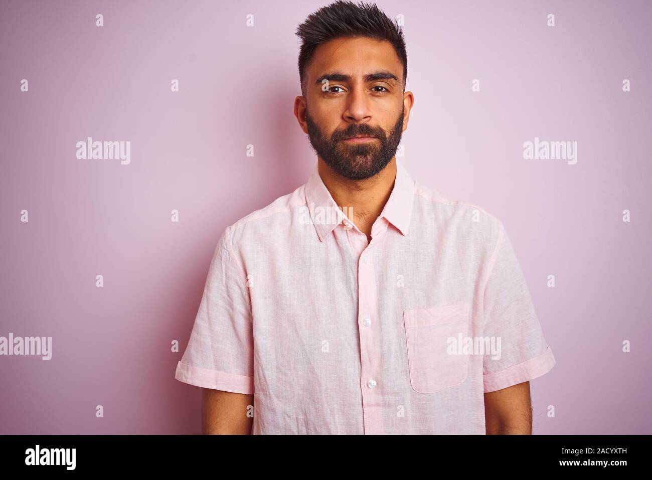 Young Indian Man Wearing Casual Shirt Standing Over Isolated Pink