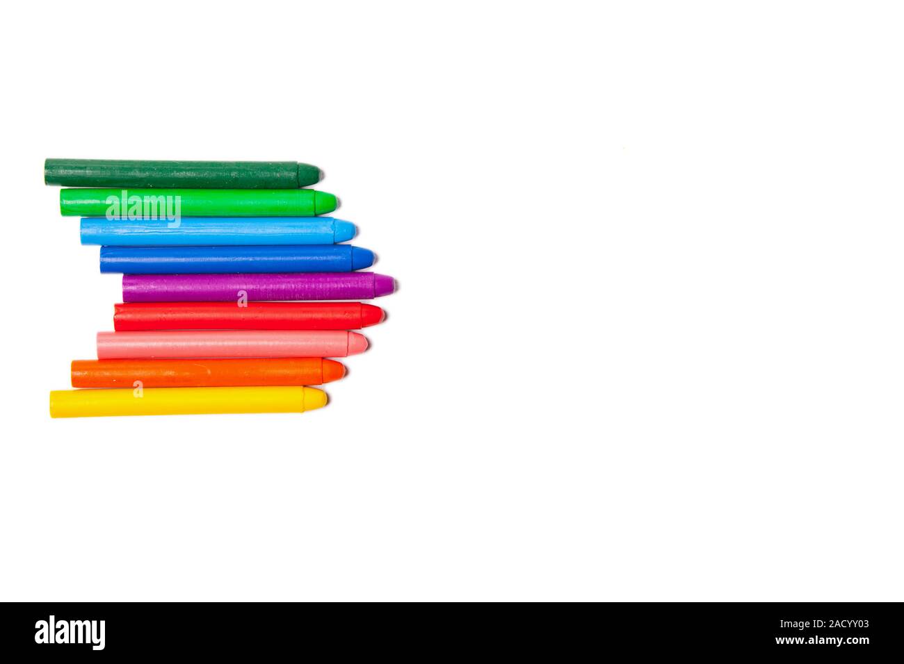 Crayons lined up in rainbow Stock Photo