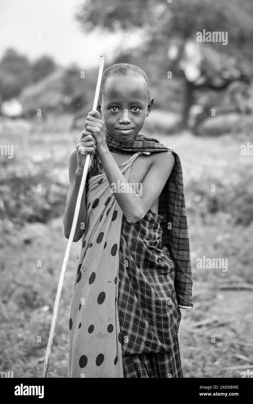 Same, Tanzania, 7th June 2019: maasai kid with a stick Stock Photo