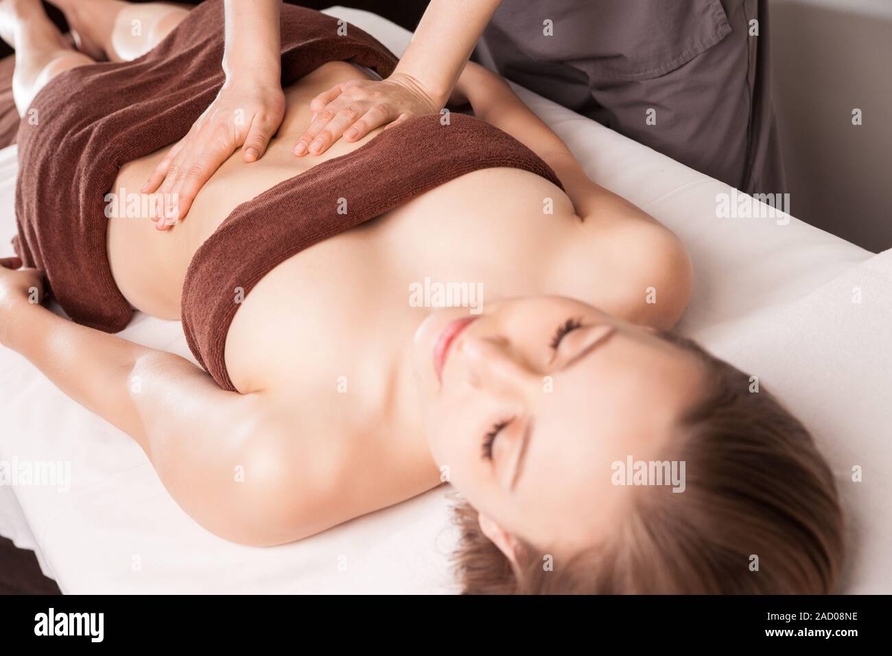 Ayurveda therapeutic arm massage with ethereal oil - Stock Image