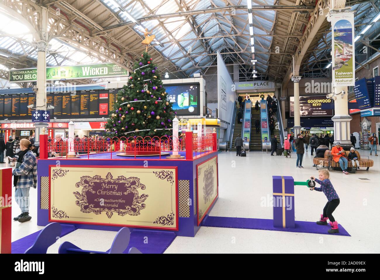 Pedal powered interactive Christmas tree, lights and music at Victoria Railway Station, Westminster, Central London Stock Photo
